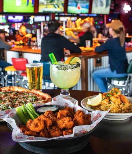 Plated table in front of a bar